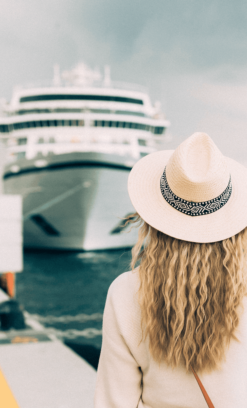 Girl standing in front of cruise ship